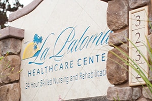 monument sign in front of La Paloma Healthcare Center